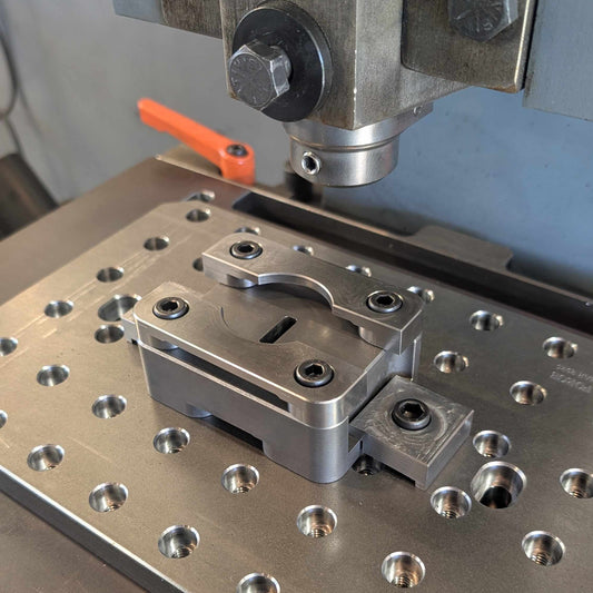 Metalworking machine with slot punch attachment on a workbench