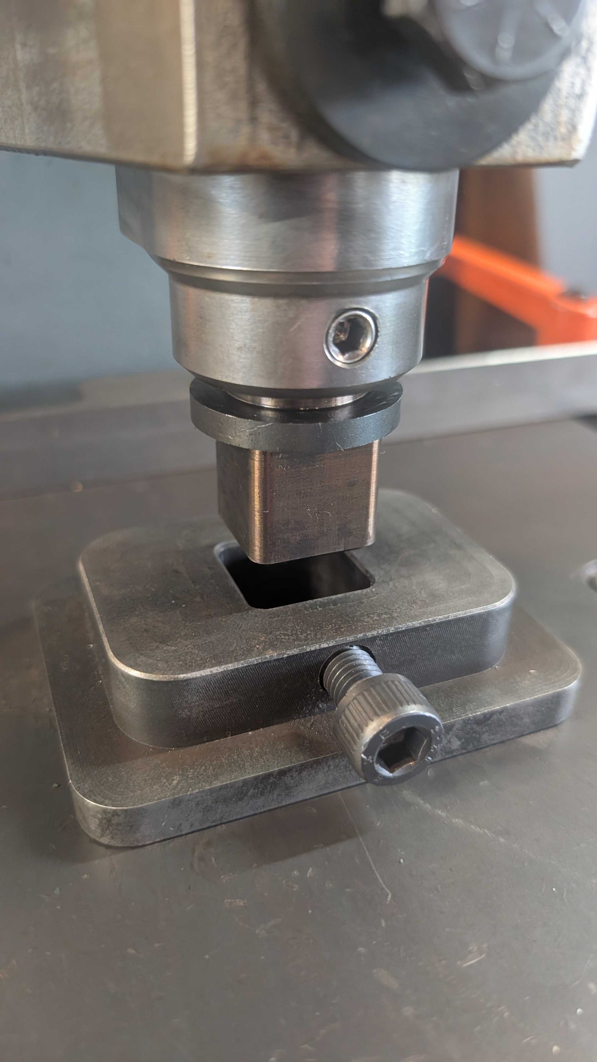 Fly Press Alignment and Indexing tool mounted in a tool holder positioned above a hardie base plate.