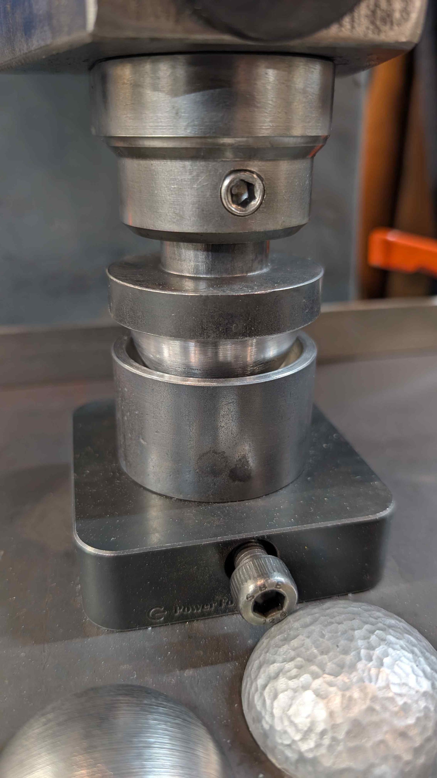 Slightly closed top and bottom round forming dies showing a perfect fit. 