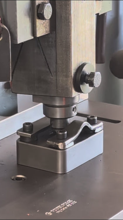 A video of a 6 x 20 mm slot punch and die punching a hole in a Railroad spike